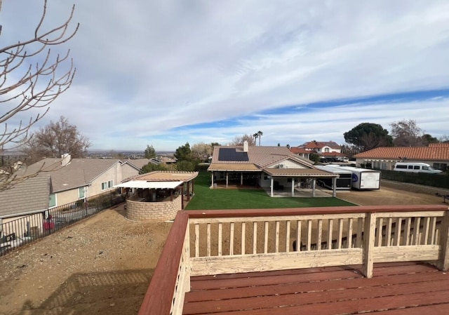 wooden deck featuring a yard