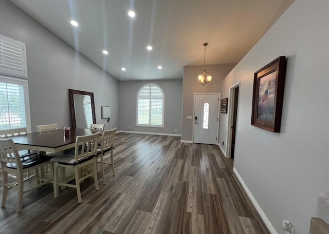 dining space featuring dark hardwood / wood-style floors and a notable chandelier