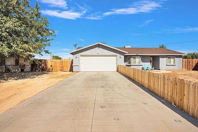 single story home featuring a garage