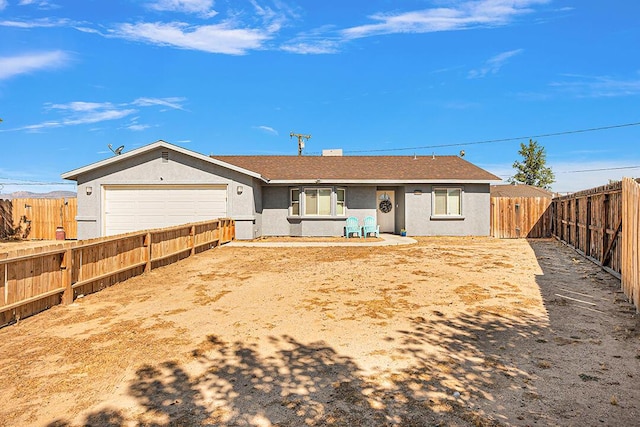 rear view of house with a garage