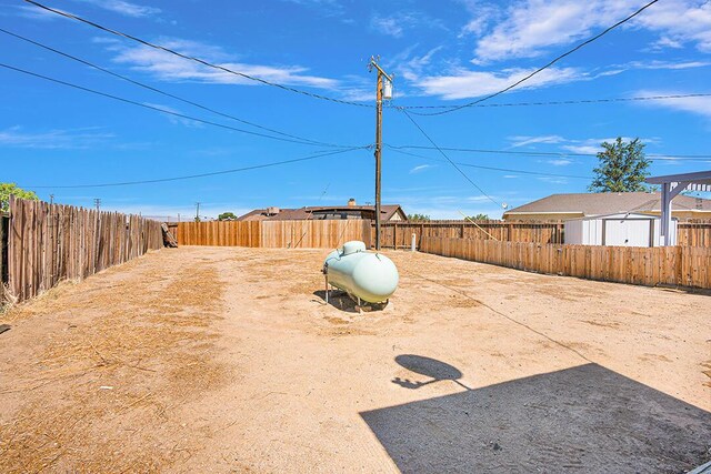 rear view of property featuring a pergola and a patio