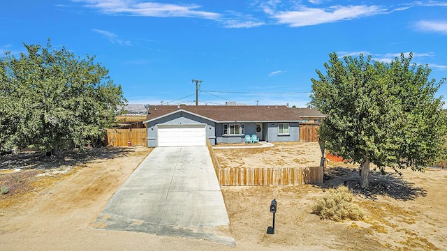 ranch-style home featuring a garage