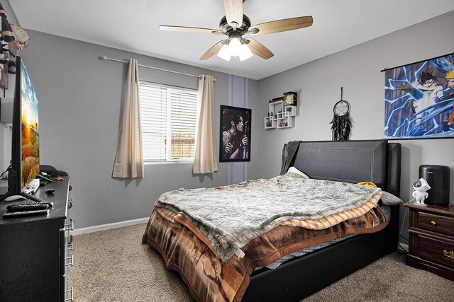 carpeted bedroom with ceiling fan and multiple windows