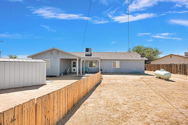 single story home with central AC and a storage unit