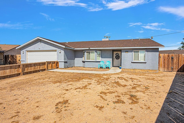 ranch-style home with a garage