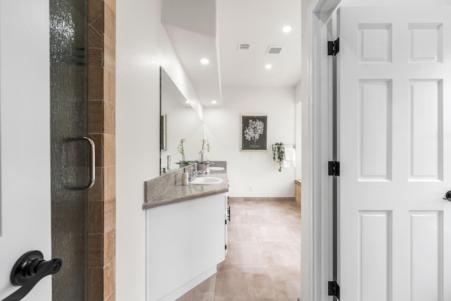 41901 Cll Clarita, Lancaster, CA 93536 - bathroom featuring double vanity, an enclosed shower, tile patterned flooring, and recessed lighting