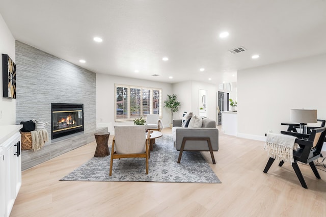 41901 Cll Clarita, Lancaster, CA 93536 - living area with a fireplace, light wood-type flooring, and recessed lighting