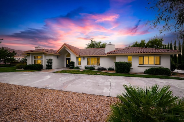 41901 Cll Clarita, Lancaster, CA 93536 - view of front facade featuring a chimney, stucco siding, and a tile roof