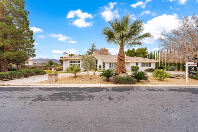 41901 Cll Clarita, Lancaster, CA 93536 - mediterranean / spanish-style home featuring a chimney, stucco siding, and a tile roof