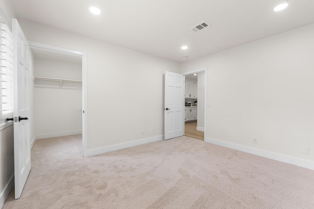 41901 Cll Clarita, Lancaster, CA 93536 - unfurnished bedroom featuring light carpet, recessed lighting, a walk in closet, and a closet