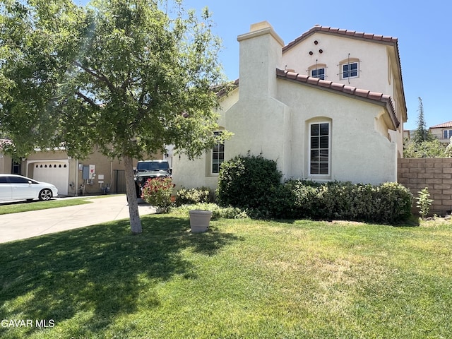 2812 Crocus Pl, Palmdale, CA 93551 - view of front facade featuring driveway, stucco siding, a front yard, and a chimney