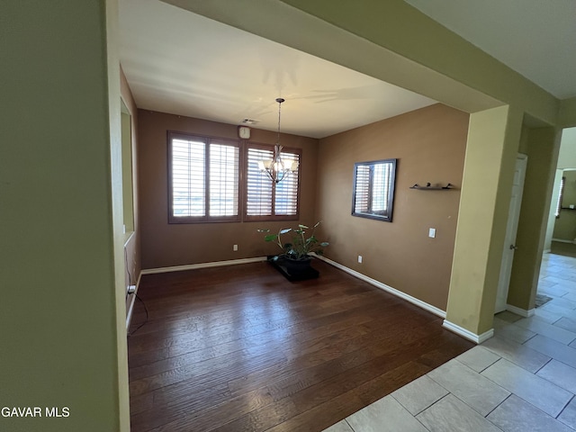 2812 Crocus Pl, Palmdale, CA 93551 - unfurnished dining area with a chandelier and wood-type flooring