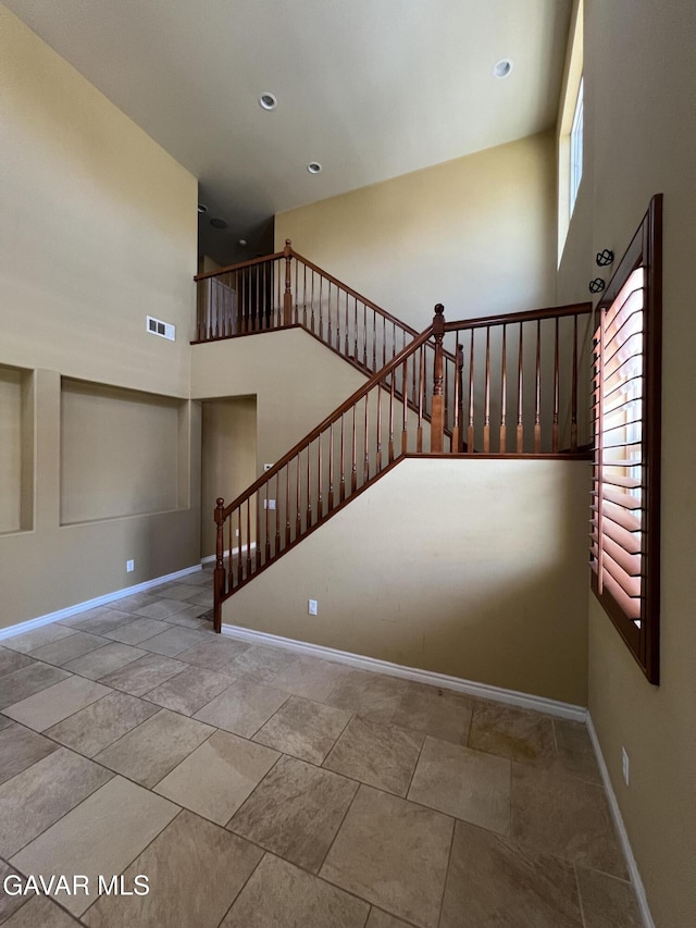 2812 Crocus Pl, Palmdale, CA 93551 - stairway with baseboards and a high ceiling