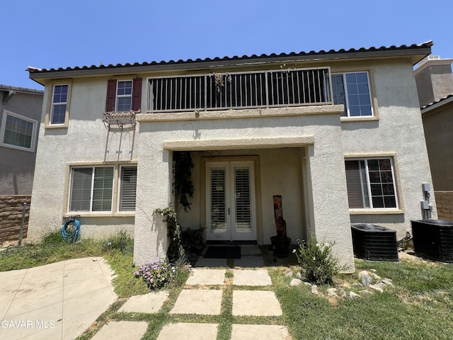 2812 Crocus Pl, Palmdale, CA 93551 - back of house with french doors, stucco siding, and a balcony