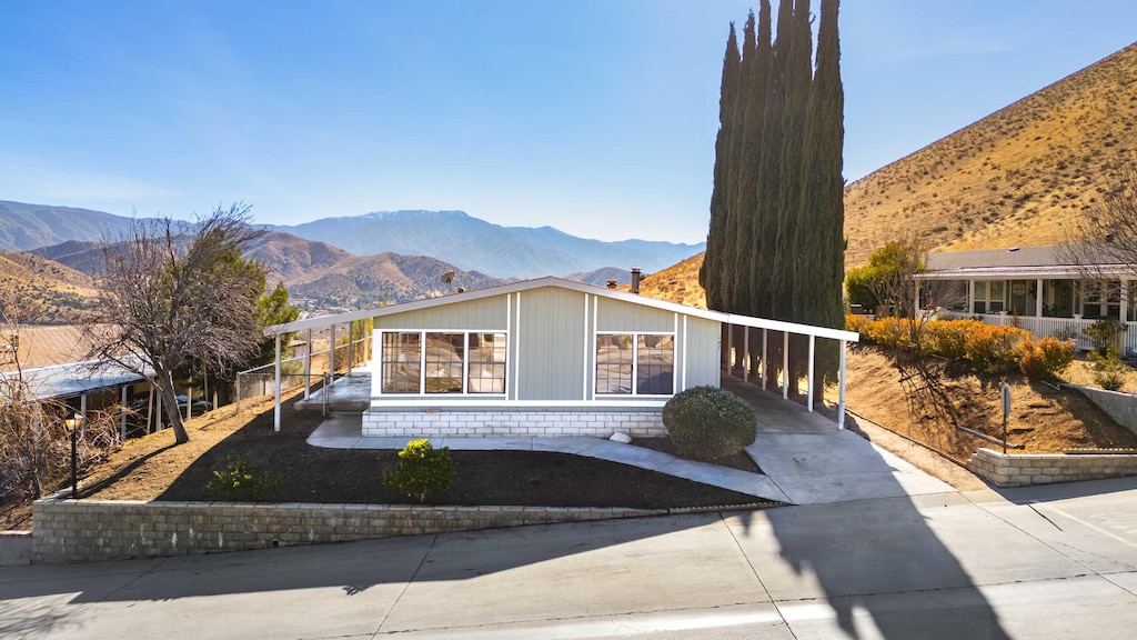 view of front of home featuring a carport and a mountain view