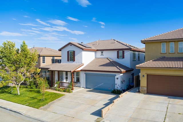 view of front facade with a front yard and a garage