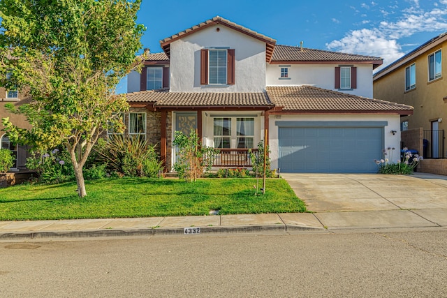 mediterranean / spanish house with a garage and a front lawn