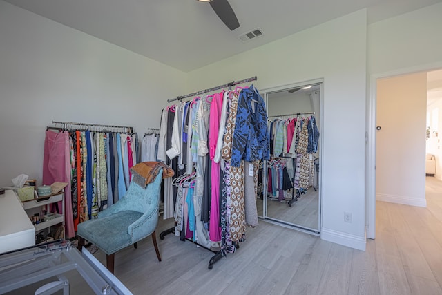 spacious closet featuring light wood-type flooring and ceiling fan