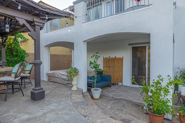 view of patio / terrace with an outdoor hangout area, a balcony, and a pergola