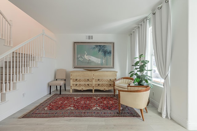 living area with hardwood / wood-style flooring