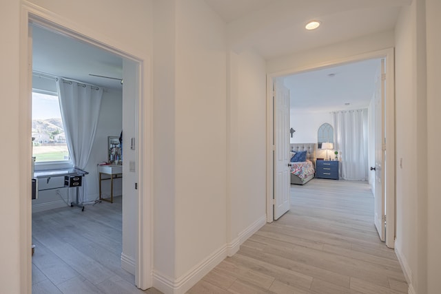 corridor featuring light hardwood / wood-style floors