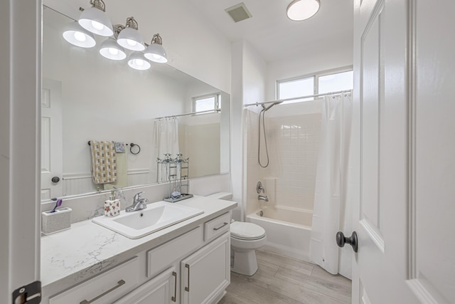 full bathroom with toilet, vanity, shower / bath combination with curtain, and hardwood / wood-style flooring