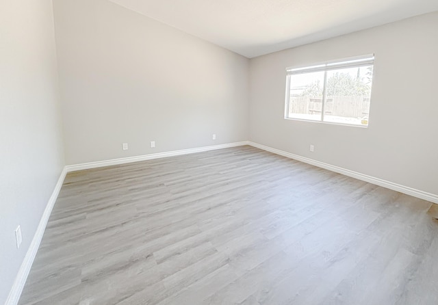 unfurnished room featuring light hardwood / wood-style flooring