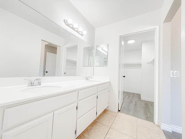 bathroom with tile patterned flooring and vanity