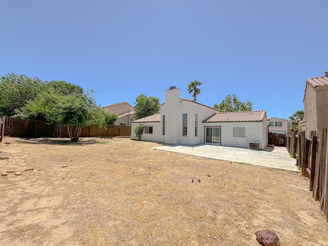 rear view of house featuring a patio