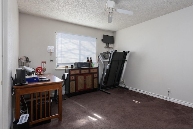 carpeted office space with ceiling fan and a textured ceiling