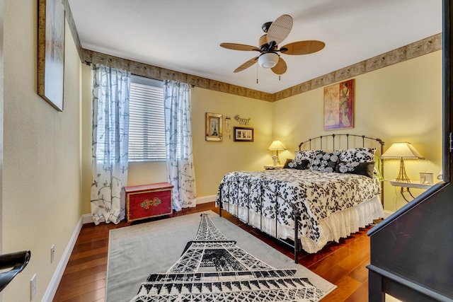 bedroom with wood-type flooring and ceiling fan