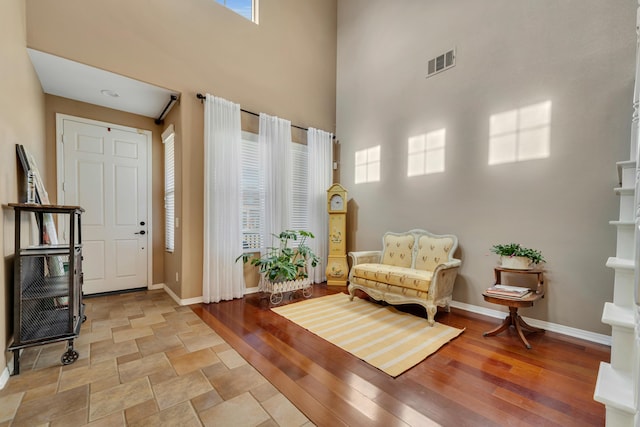 sitting room with a high ceiling