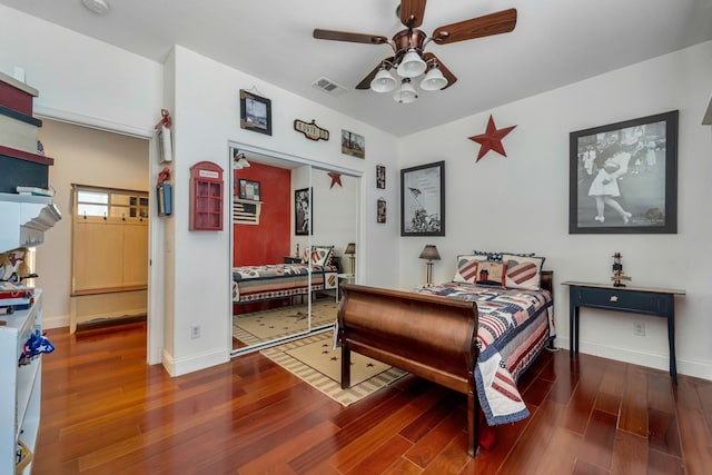 bedroom featuring a closet, ceiling fan, and dark wood-type flooring