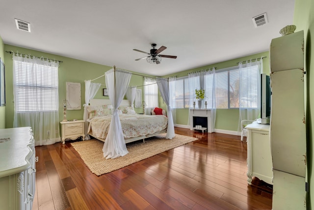 bedroom featuring dark hardwood / wood-style floors and ceiling fan