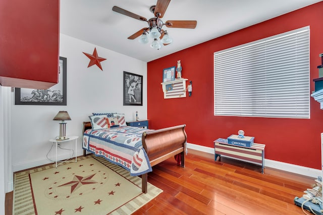 bedroom featuring ceiling fan and hardwood / wood-style floors