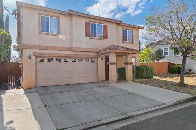 40305 Reata Rd, Palmdale, CA 93550 - traditional home with an attached garage, driveway, stucco siding, and fence