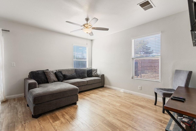 40305 Reata Rd, Palmdale, CA 93550 - living room with a ceiling fan, light wood-style flooring, and baseboards
