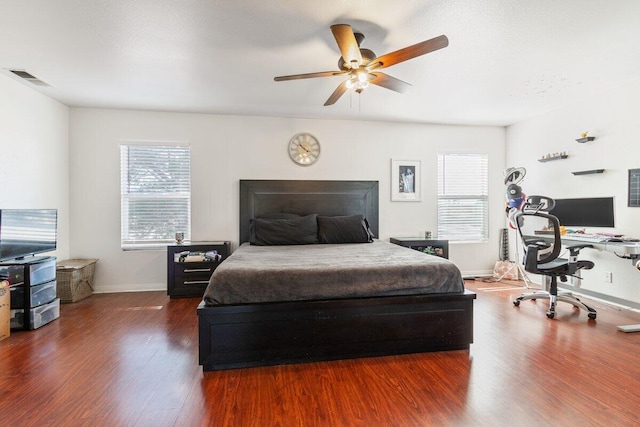 40305 Reata Rd, Palmdale, CA 93550 - bedroom with wood finished floors, a desk, baseboards, and a ceiling fan