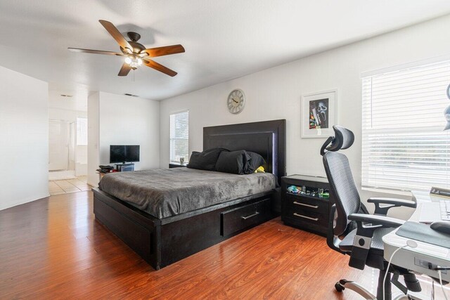 40305 Reata Rd, Palmdale, CA 93550 - bedroom with wood finished floors, an office area, and a ceiling fan