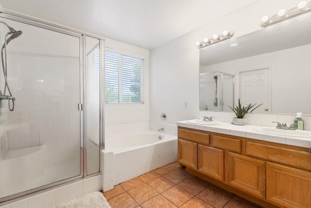 40305 Reata Rd, Palmdale, CA 93550 - bathroom with a shower stall, tile patterned floors, a bath, and double vanity