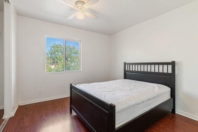 40305 Reata Rd, Palmdale, CA 93550 - bedroom with wood finished floors, baseboards, and a ceiling fan
