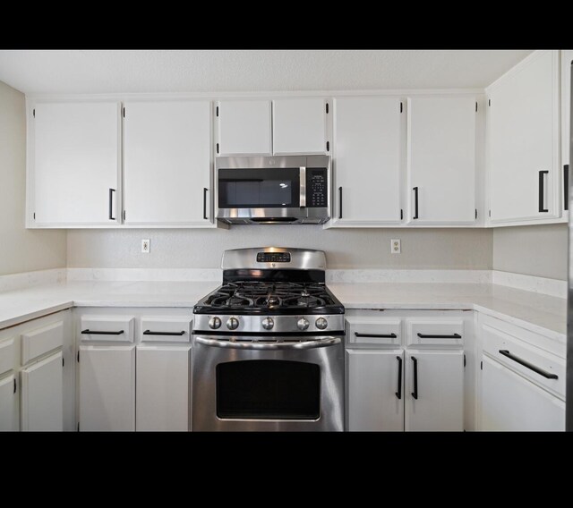 kitchen featuring white cabinets and stainless steel appliances