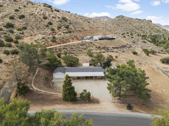 birds eye view of property featuring a mountain view and a rural view