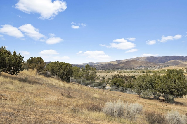 view of mountain feature with a rural view
