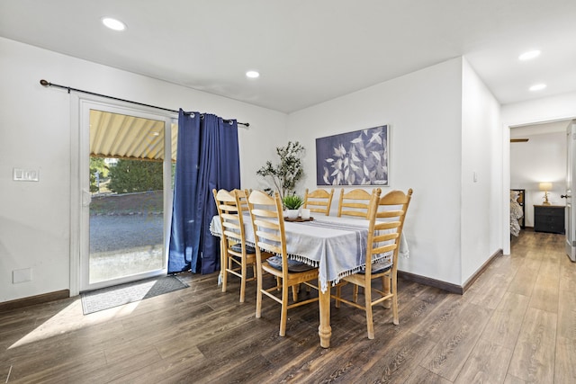 dining space with recessed lighting, baseboards, and wood finished floors