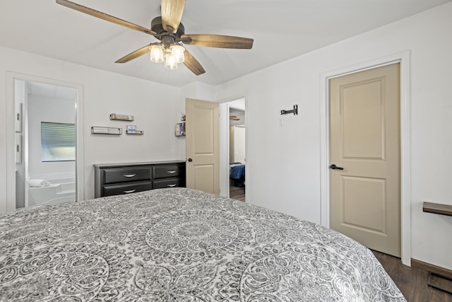 bedroom featuring connected bathroom, dark wood-style flooring, and ceiling fan