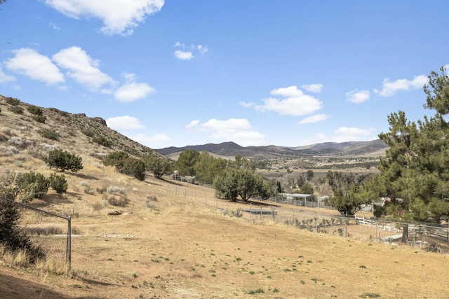 mountain view featuring a rural view