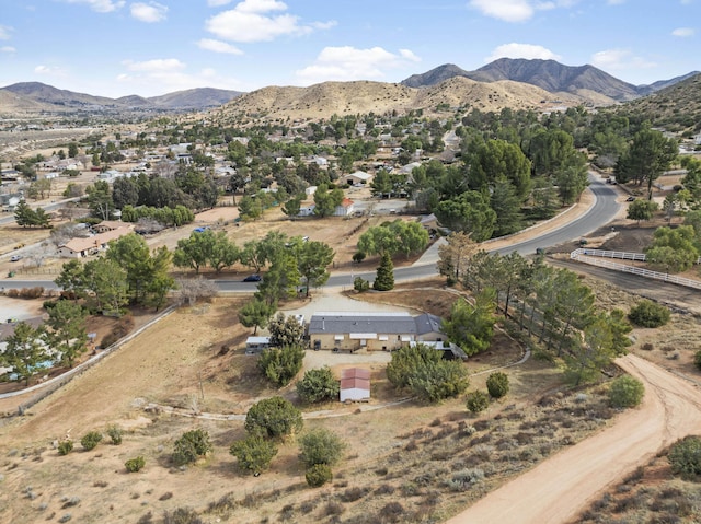 birds eye view of property with a mountain view