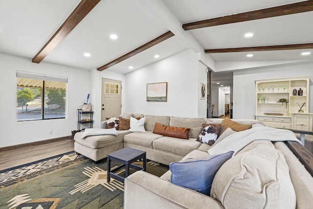 living area featuring baseboards, vaulted ceiling with beams, recessed lighting, and wood finished floors