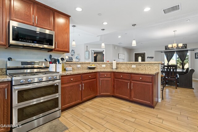 18551 Jacks Hill Rd, Tehachapi, CA 93561 - kitchen with appliances with stainless steel finishes, a peninsula, light wood-type flooring, a chandelier, and recessed lighting